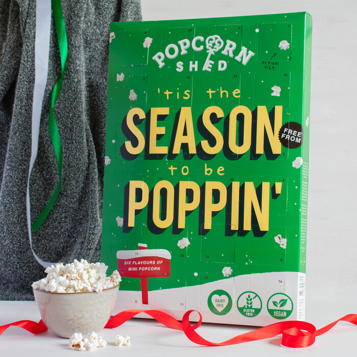 Popcorn Shed Vegan Mini Pop Advent Calendar on a festive backdrop with red ribbon